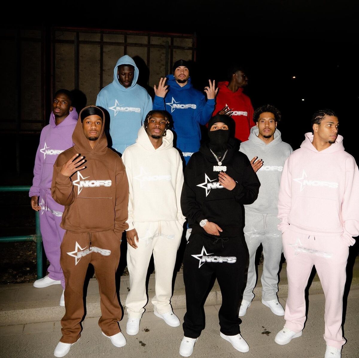 group of people wearing nofs tracksuits